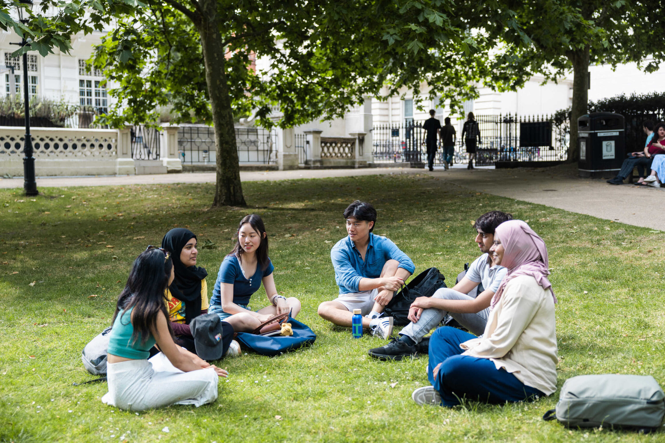 A group sitting on the grass at East Side.