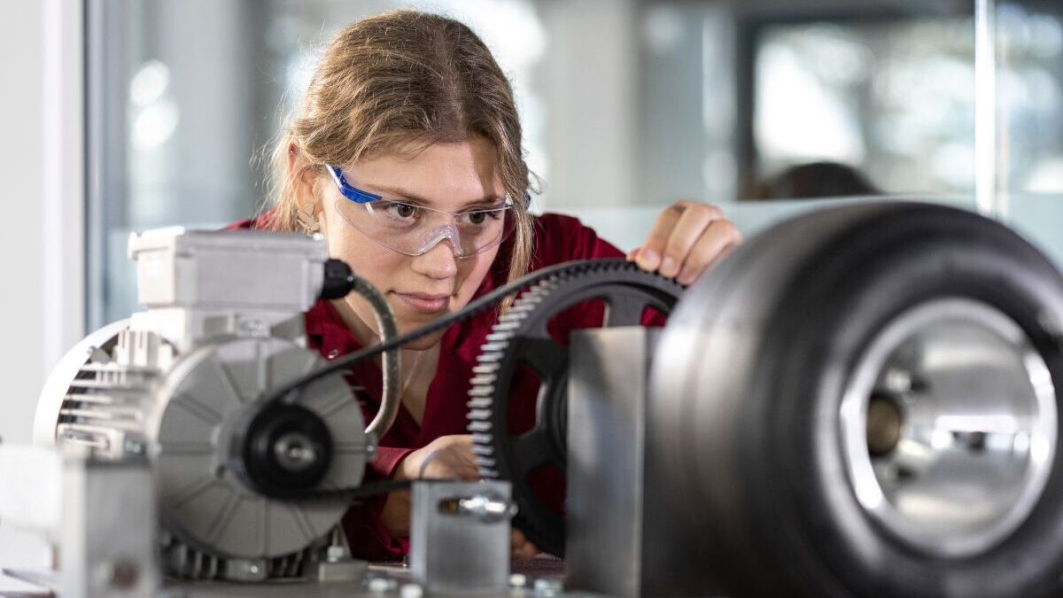 Mechanical engineering student working on an engine